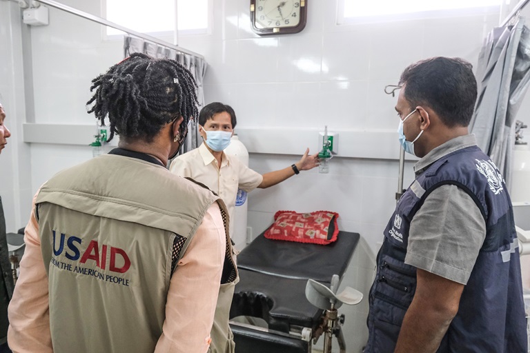 man checking the oxygen tanks